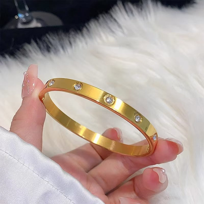 Gold Crystal Bracelet – Sleek Modern Design with Embedded Gemstones