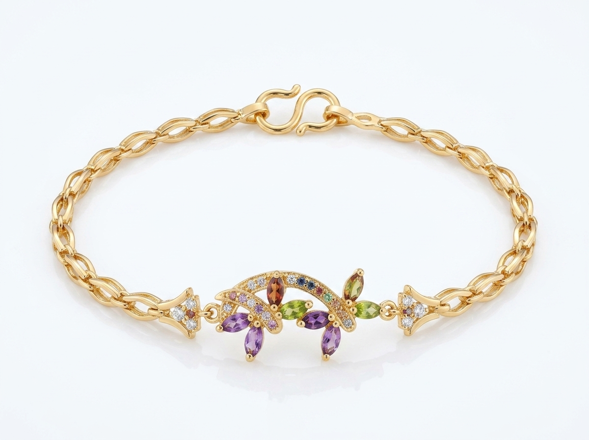 Close-up image of multi-stone gold plated bracelet on white background